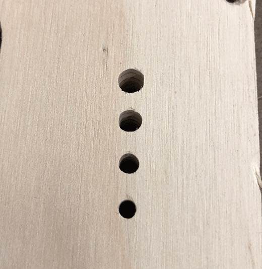 Trying different hole sizes with the cnc router to see which would hold the sheet metal screw without gripping it.