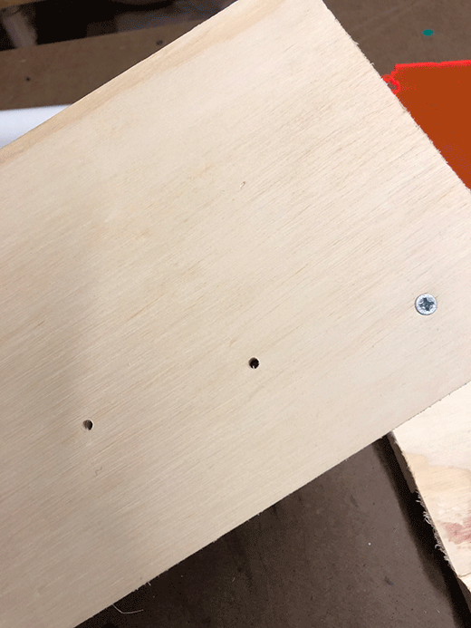 Cnc routed holes to guide the sheet metal screws to be aligned with the dowels