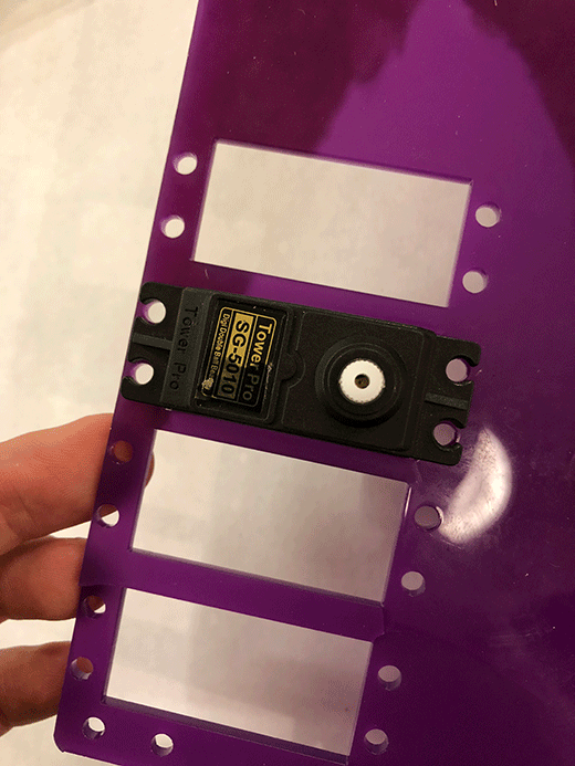 Testing the alignment of the servo mount and the holes on the acrylic